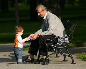 man giving child a gift